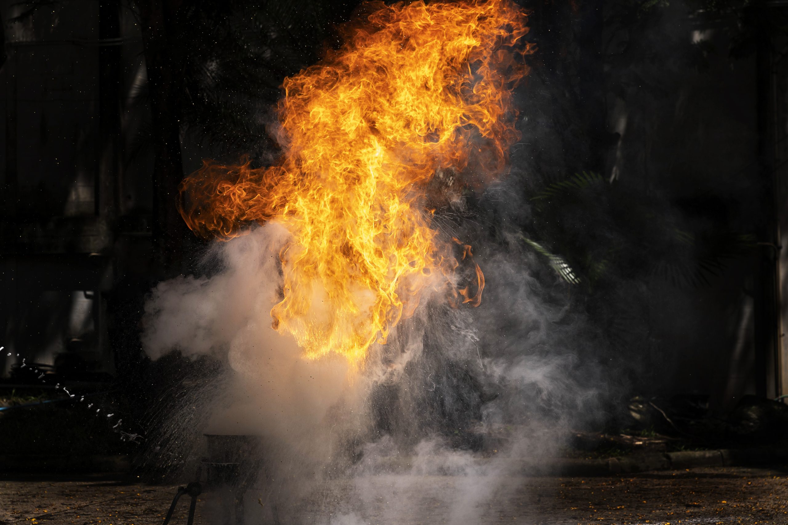 FireGuy creating a fireball on a stage for a show.