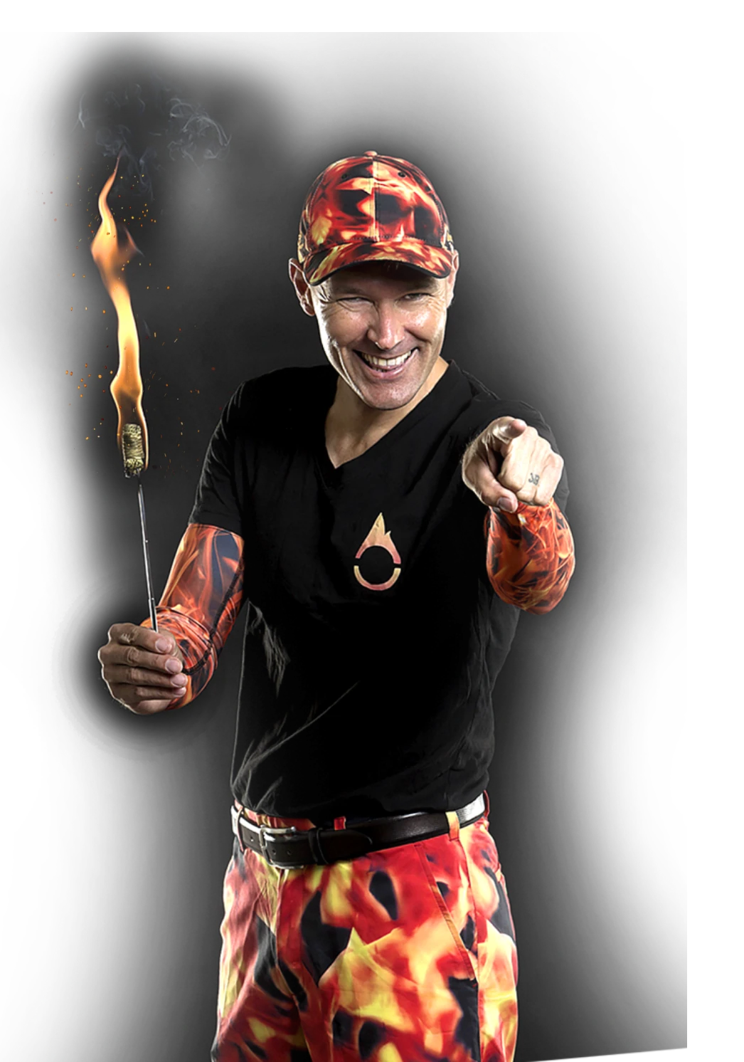 FireGuy is holding a fire stick, and pointing as though pointing at you specifically with a huge happy smile.