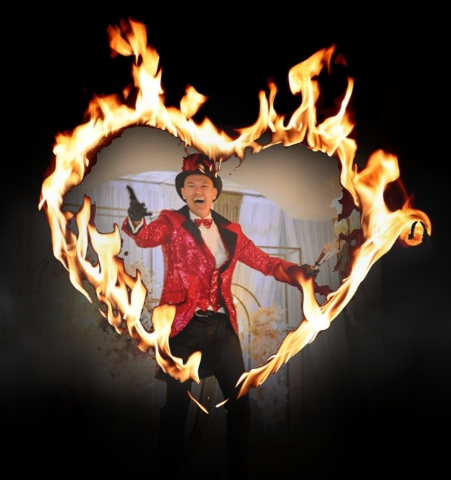 FireGuy standing in the center of a fiery heart with a big smile, holding out his hand.