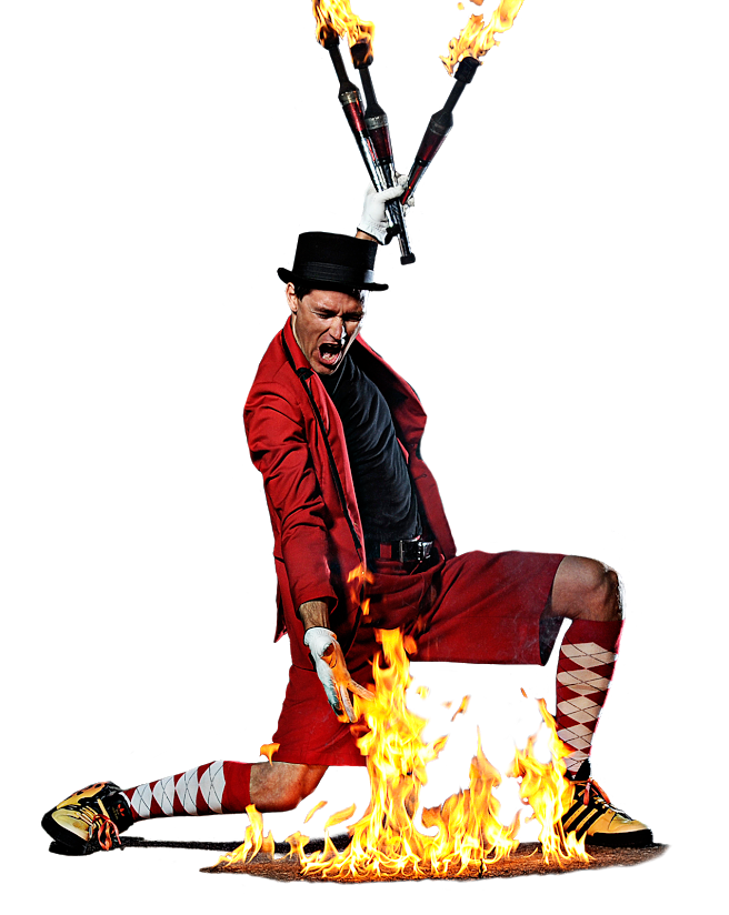 FireGuy presenting a fireball on the ground with his hand, holding 3 juggling fire sticks with clear background.