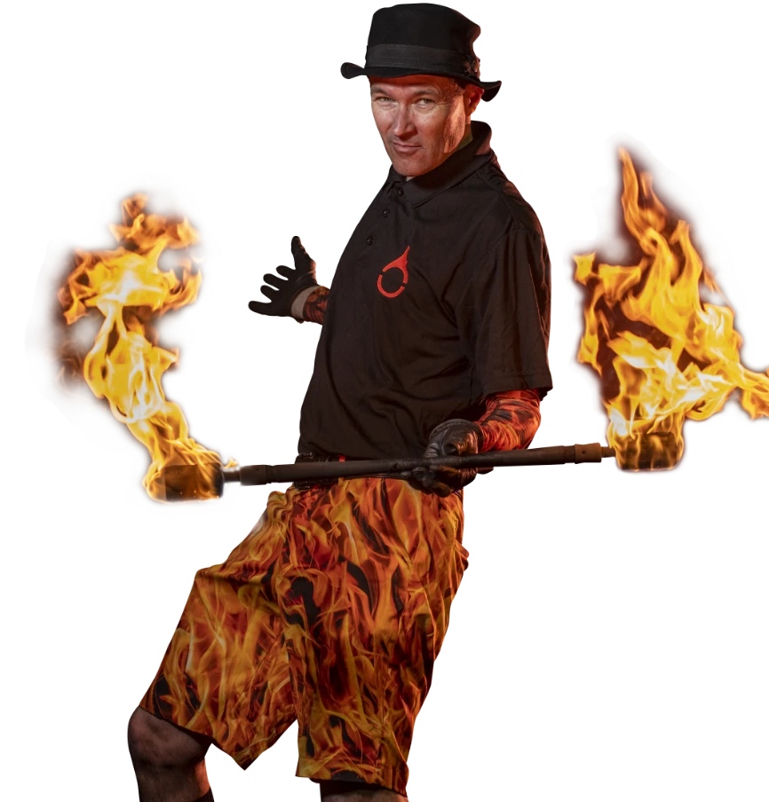 FireGuy dancing with his lit fire baton. Background removed.
