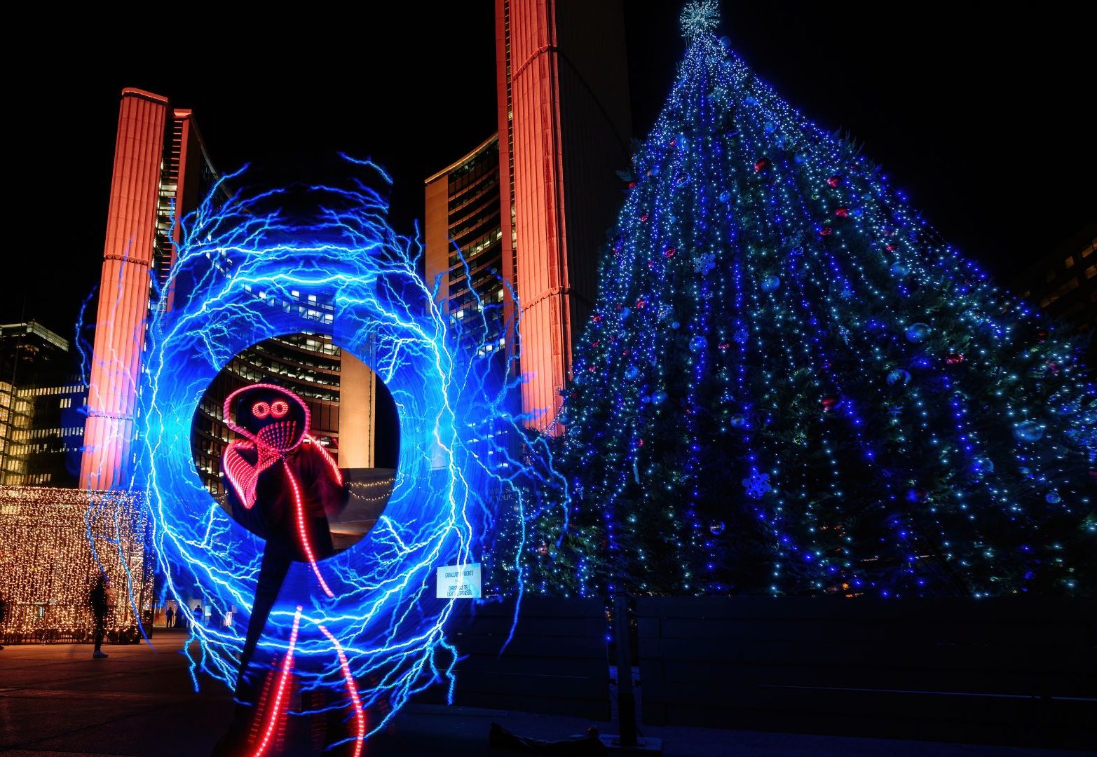 GlowGUy using LED spinners to create electricity in a circle around himself.