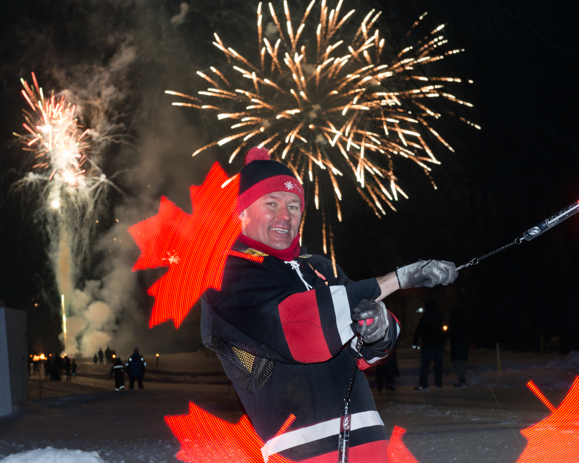 FireGuy using LED Spinners to create the Canadian flag maple leaf in a circle during a celebration in Canada.